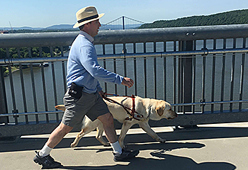 With a quick pace and a long stride, Hogan guides Pat over the Hudson River. The Allegheny mountains are in the background.
